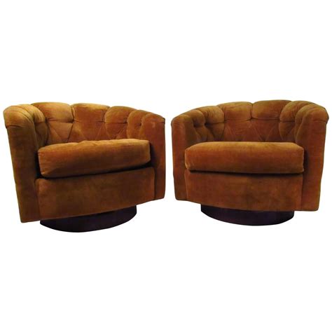 Selig was a very popular make of eames style chair sets and is very hard to come by nowadays. Pair of Mid-Century Tufted Barrel Back Swivel Lounge Chairs by Selig at 1stdibs