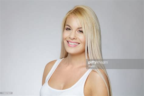 Beautiful Blond Woman In White Tank Top Smiling At Camera High Res