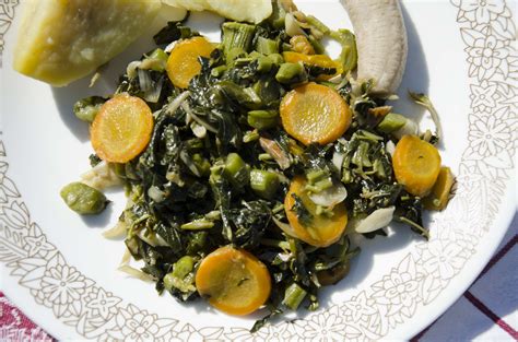Steamed Callaloo And Boiled Food Tines That Bind