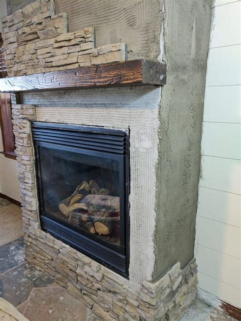 Wearing latex gloves helps to keep the stain off of your hands! Stacked Stone Fireplace Remodel | Diy fireplace makeover ...