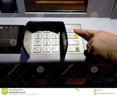 Close Up Of Hand Entering Pin At An Atm Female Arms Atm Entering