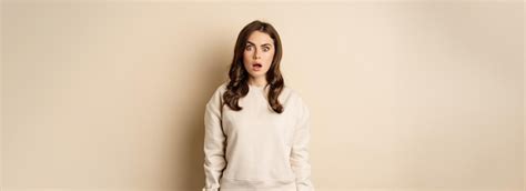 Free Photo Portrait Of Shocked Brunette Woman Drop Jaw Gasping And