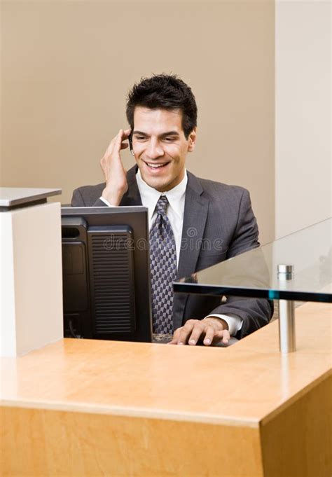 Male Receptionist Talking On Telephone Earpiece Stock Image Image Of