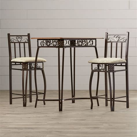 This 3 piece pub table set is a modern contemporary dining set for two. August Grove 3 Piece Counter Height Pub Table Set ...
