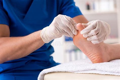 The Podiatrist Treating Feet During Procedure Stock Photo Image Of