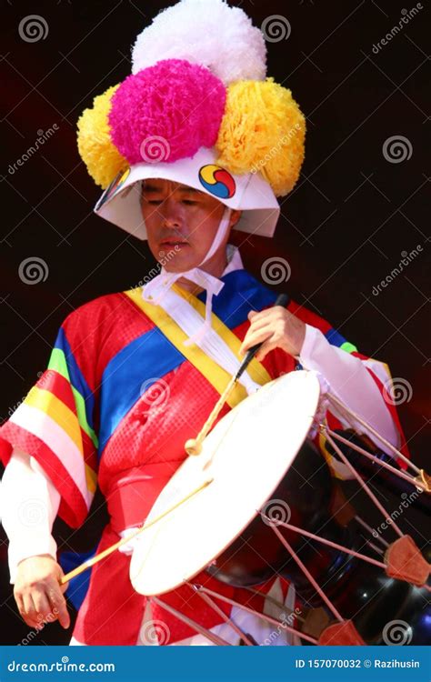 Korean Drummer Playing The Traditional Hourglass Shaped Drum Also Known As Janggu Editorial