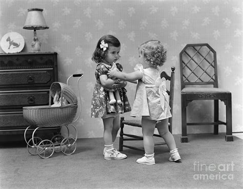 Two Girls Playing With Dolls C1940s Photograph By H Armstrong