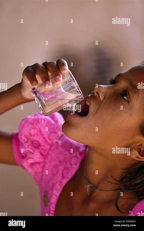 Indian Girl Drinking Water India Stock Photo Alamy