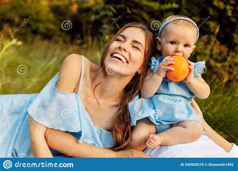 Portrait Of Overjoyed Smiling Mother With Adorable Daughter Stock Image Image Of Grass Person