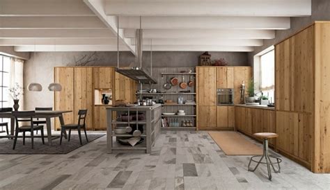 Table ilot central dejeuner, avec plateau en bois et pied caisson bois noir rappelant la finition feuille de pierre des crédence et du mur avec la cheminée coté pratique, nous retrouvons de nombreuses prises de courant sur tout le plan de travail. ilot cuisine salle a manger