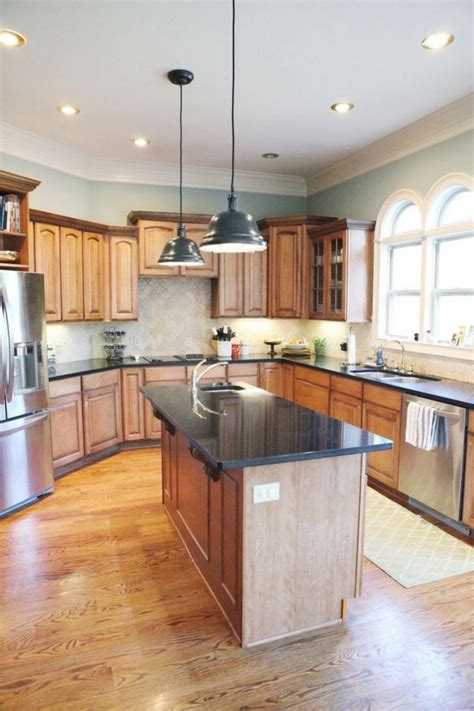 It is going to allow you to make use of something such as stainless steel and glass to help make the kitchen area appear modern and bright. 35+ Beautiful Kitchen Paint Colors Ideas with Oak Cabinet ...
