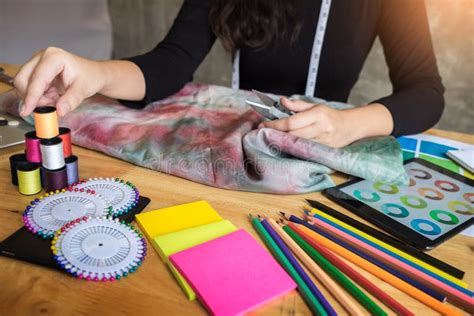 Beautiful Young Fashion Designer Woman Choosing Thread For Sewing