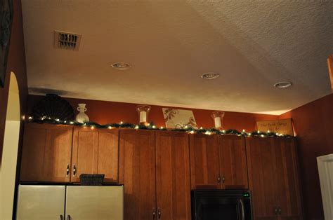 Decorate over your door way or use above your kitchen cabinets. Classic with a Pop: Christmas Home Tour 2010