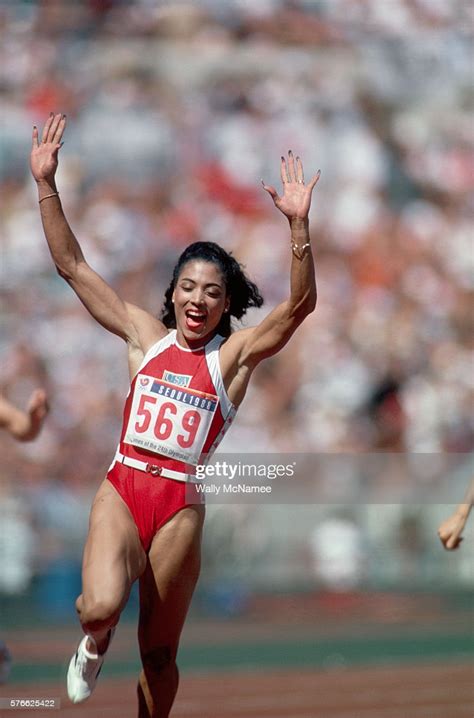 She holds the world records in the 100 m and 200 m races. Track and field runner Florence Griffith Joyner celebrates ...