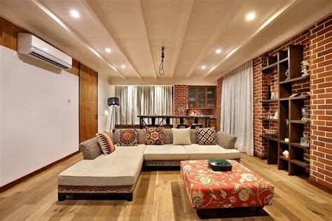 All the essential furniture and on the other hand, in a living room or kitchen, a bright shade can bring a cheery ambiance to the what type of flooring is ideal for indian homes? Modern Indian Living Room With Decorative Brick Wall ...