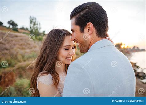 Close Up Portrait Of A Beautiful Married Couple Laughing Stock Image