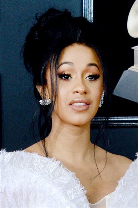 The curly faux hawk is literally perfect on the rapper, who. Cardi B Wavy Black Face-Framing Pieces, Updo Hairstyle ...