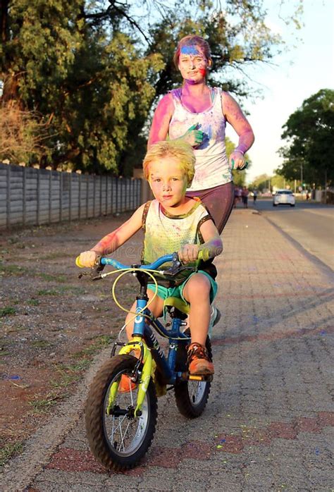 Mom And Son On Bicycle Covered With Powder Paint At Colour Run Editorial Photo Image Of Club