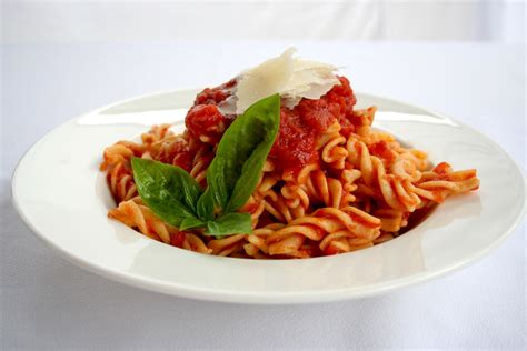 I call it a million dollar spaghetti because it is quick and easy but tastes like a fancy italian restaurant dinner. Spiral pasta with Napolitana Tomato sauce - Dominique Rizzo