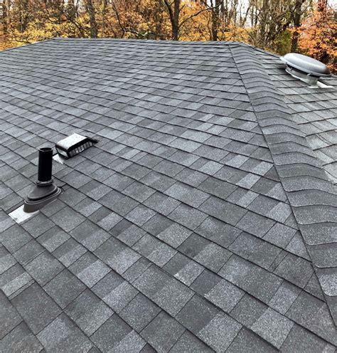 The moire black is a lighter shingle. CertainTeed Landmark Pro Charcoal Black shingles ...