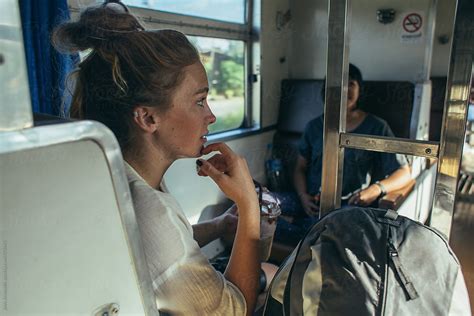 Two Girls Travelling Together On A Train By Jovo Jovanovic