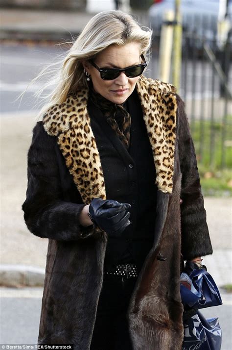 Kate Moss Flashes Smile As She Steps Out In Leopard Print Fur Coat