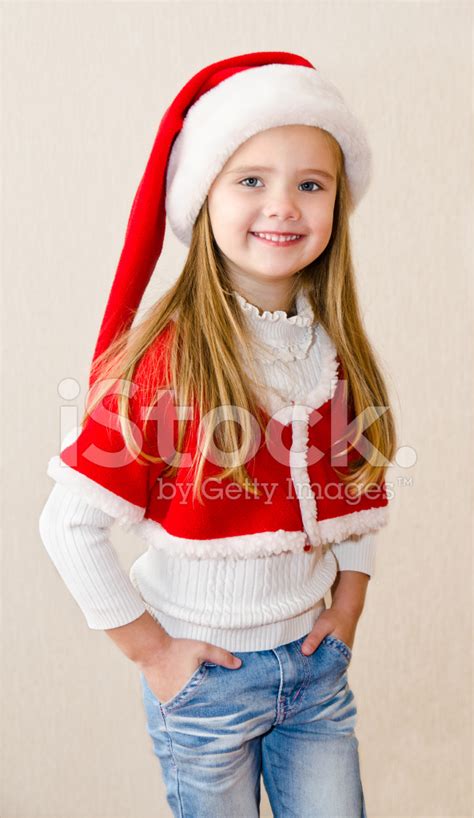 Happy Smiling Little Girl In Christmas Hat Stock Photo Royalty Free