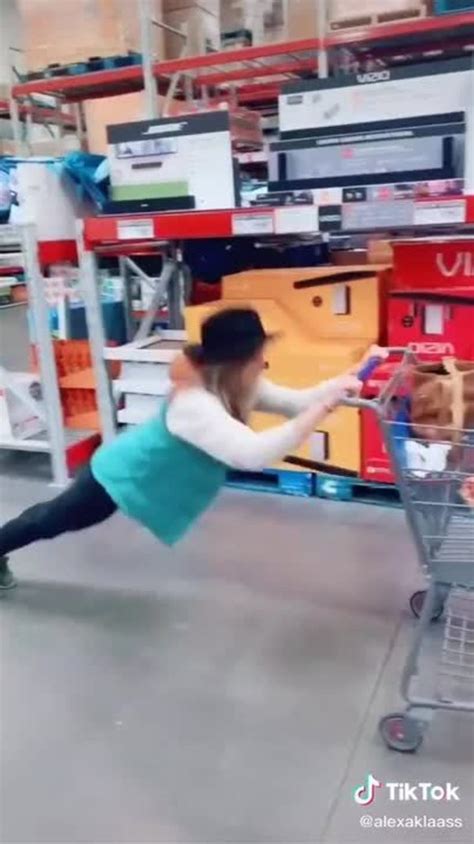 Woman Slips And Falls On Floor While Attempting To Perform Trick Using A Shopping Cart Jukin