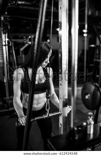 Woman Flexing Muscles On Cable Machine Stock Photo 612924548 Shutterstock