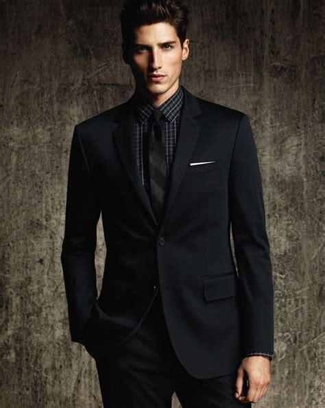a man in a black suit is the best well dressed men black and white suit black fitted suit