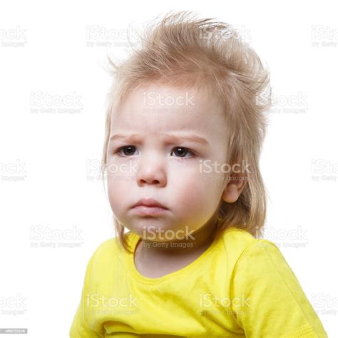 Portrait Frowning Baby Isolated On White Background Stock Photo