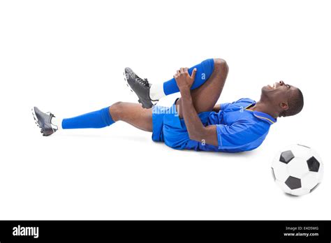 Injured Football Player Lying On The Ground Stock Photo Alamy