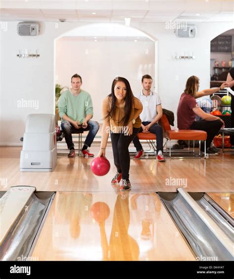 Woman Throwing Bowling Ball In Club Stock Photo 63418848 Alamy