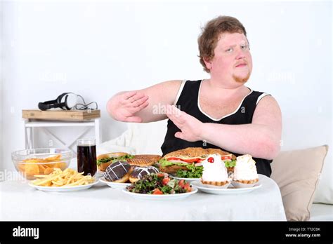 Fat Man Do Not Want To Eat A Lot Of Unhealthy Food On Home Interior