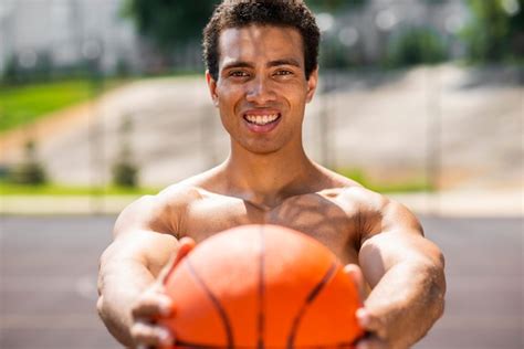 Free Photo Handsome Man Holding A Ball Medium Shot