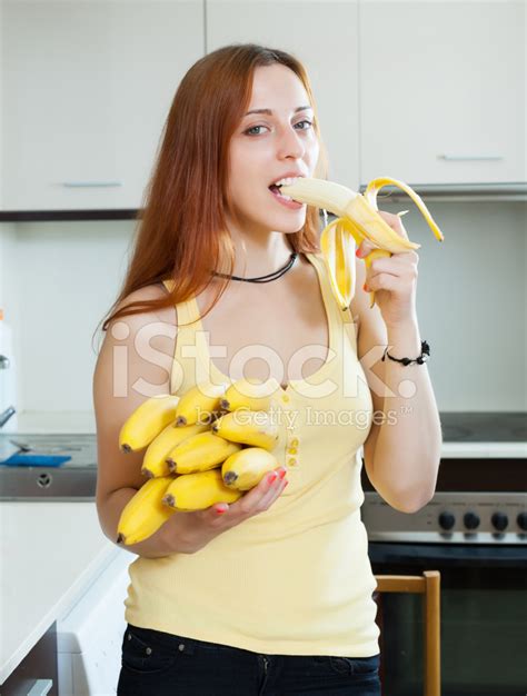 Long Haired Woman Eating Banana Stock Photo Royalty Free Freeimages