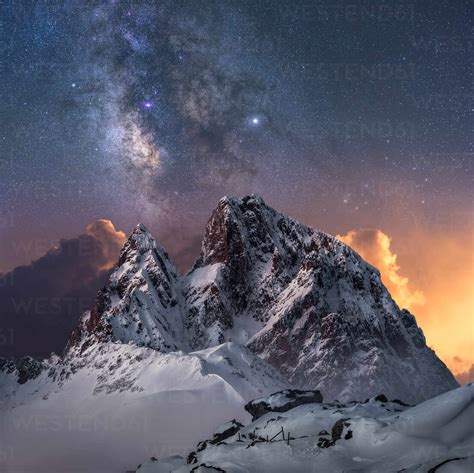 Amazing View Of White Snowy Mountain Range Under Incredible Night