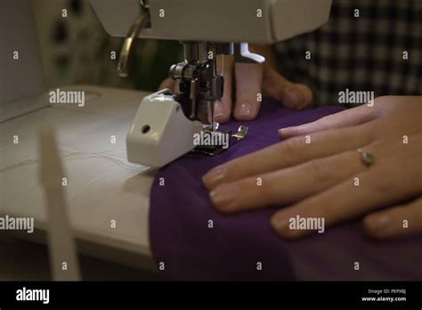 Fashion Designer Using Sewing Machine In Fashion Studio Stock Photo Alamy