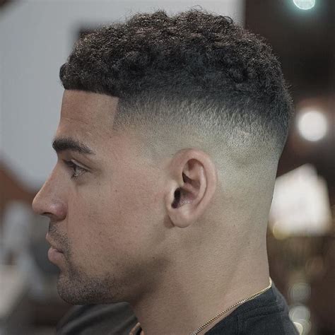 Short hair with bald fade for a black man. 50 Fade and Tapered Haircuts For Black Men