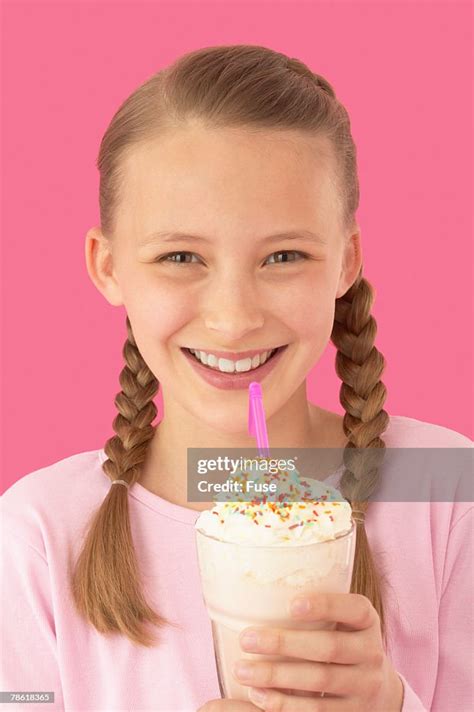 Pre Teen Girl Enjoying Milkshake High Res Stock Photo Getty Images