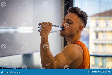 Young Man Drinking Water From Plastic Bottle Stock Image Image Of