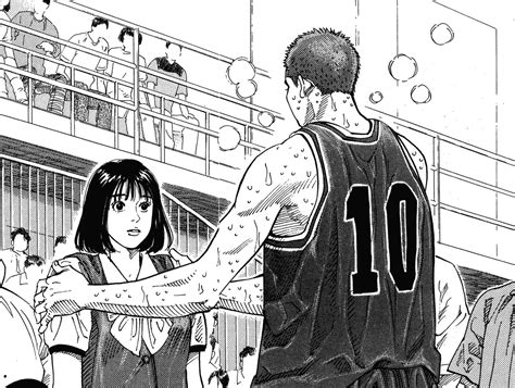 A Man And Woman Are Standing Next To Each Other In Front Of A Basketball Court