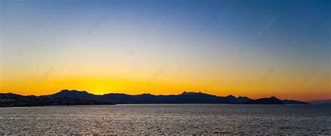 Vibrant And Stunning Mediterranean Sunset Featuring Islands Mountains