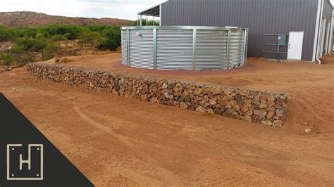 Rough and industrial in the best ways, these walls can add a major dose of textural interest to landscapes and — depending on what's used to fill them — can help keep rocks and leftover construction materials out of landfills. INEXPENSIVE AMAZING DIY GABION RETAINING WALL - YouTube