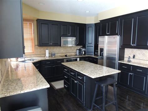These gray kitchen cabinets create a great harmony with glossy black countertop. Granite Counter Colors Gray Kitchens Blue Granite ...