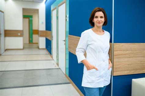 Female Doctor Standing In Clinic Corridor Stock Photo Image Of