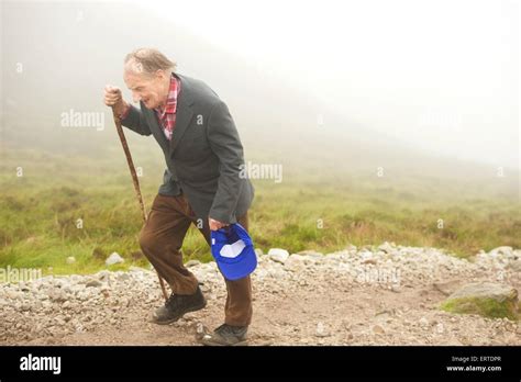 An Old Man Climbing Croagh Patrick A Holy Mountain In County Mayo In