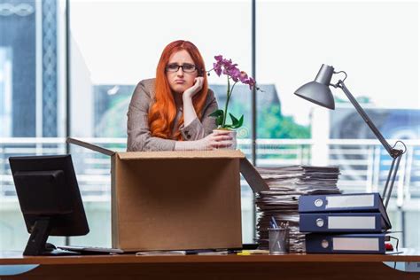 the red head woman moving to new office packing her belongings stock image image of container