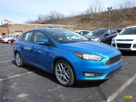 2015 Blue Candy Metallic Ford Focus Se Sedan 102378666