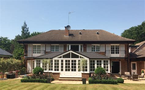 Glass facades and the undulating roof highlight the extravagant appearance of the vandusen visitor. Guardian Warm Roof System - Orchid Windows